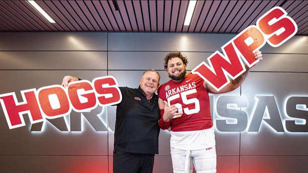 Coach Sam Pittman and transfer left tackle Fernando Carmona pose for picture as he commits on official visit.